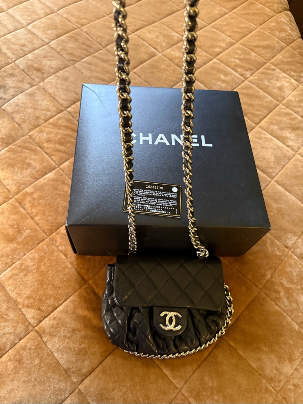 CHANEL Black Quilted Leather Mini Crossbody with Silver Tone Chain